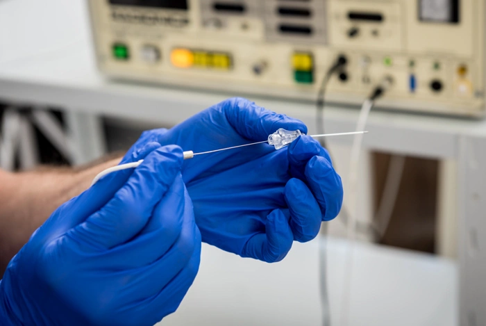 Cardiologist use tubes for radiofrequency catheter ablation.