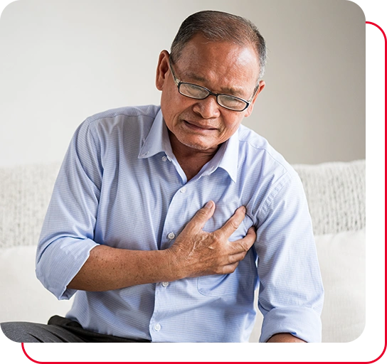Close Up senior male asian suffering from bad pain in his chest heart attack at home.